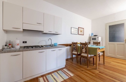 Vito d'Asio Apartment | Cosy apartment for 4 guests with pool, WIFI, TV, patio and pets allowed