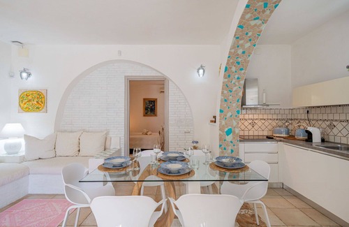 Eden Beach Villa | Cosy apartment in villa for 11 people with pool, A/C, WIFI, TV, patio, pets allowed and parking