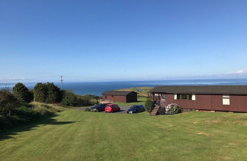 Aberdovey Ski Chalet | Cosy Swiss-Style Wooden Chalet in Aberdovey, Snowdonia with stunning sea views
