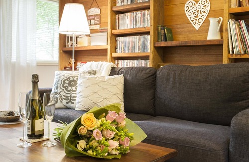 Olinda Cottage | Cottage In The Forest - Relax in your King size bed looking out onto the forest, curl up on the lounge with open wood fire.