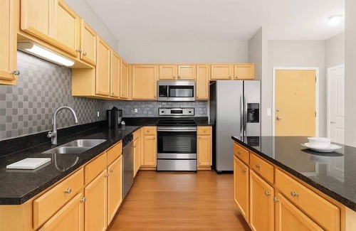 West Seventh Apartment | Cozy 2BR | King + 2 Queens + Walk to Xcel Arena