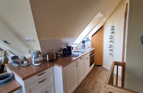 Norddeich Apartment | Cozy attic studio Norddeich panoramic window with sea view beach 50 meters