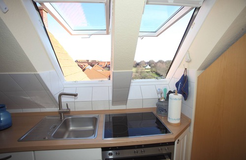 Norddeich Apartment | Cozy attic studio Norddeich panoramic window with sea view beach 50 meters