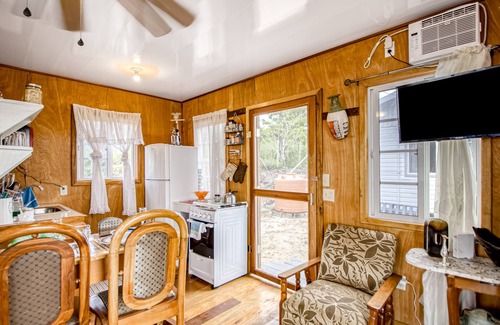 Georgeville Cabin | Cozy cabana with shared plunge pool, scenic views, kitchenette, AC, & WiFi