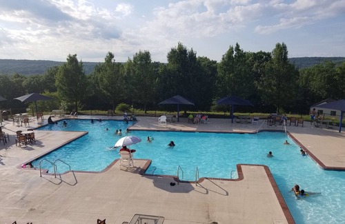 Bushkill Cabin | Cozy Cabin Escape with indoor & outdoor pools, hot tubs, tennis, skiing & more