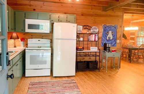 Dial Cabin | Cozy Cabin in woods with Hot Tub, Porch Swing Bed and Fire Pit in Aska Adventure