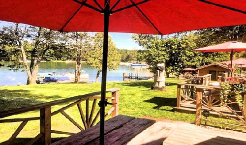 West Branch House | Cozy Cabin Rental with Stunning Lake Views in West Branch, Michigan