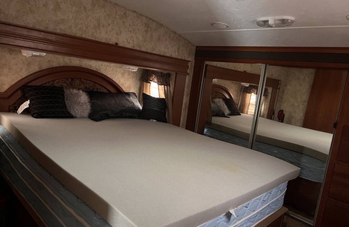 Charlotte House | Cozy camper trailer with great views of the sky. Fire pit great for entertaining