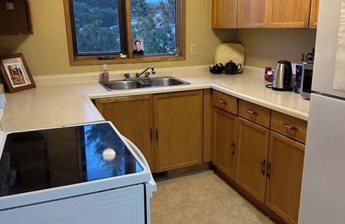 Taber House | Cozy Getaway: 2-Story Bungalow in Taber: Old-Fashioned Charm with big trees.