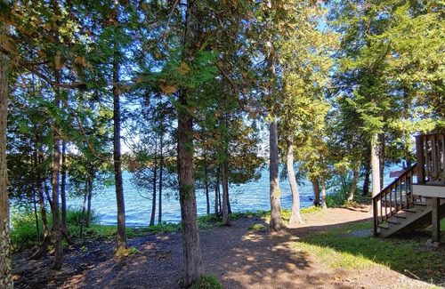 Dexter House | Cozy lakefront home w/ a firepit, outdoor shower, & private beach!