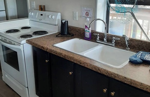 Camden House | Cozy Lakeview Cabin 12 for Large Groups Within a Marina