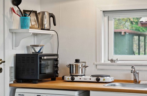Kalvehave Cottage | Cozy little annex with a sea view.