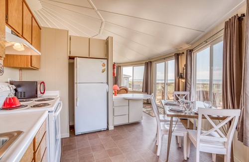 Bayshore House | Cozy Oceanfront Home with Wrap Around Windows! Beach access on the property!