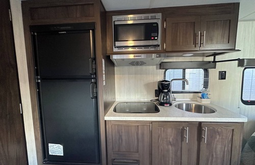Courier City - Oscawana House | Cozy RV in Tampa, Hyde Park area with WiFi, AC. Close to UT, downtown.