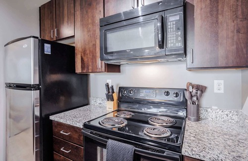 Central Business District Apartment | CozySuites at the Banks gym, pool 12