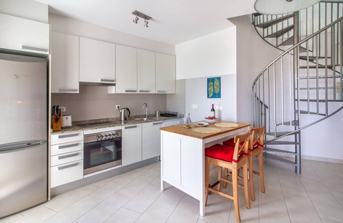 Muchamiel Apartment | Daylight friendly apartment with sea view and shared outdoor pool.