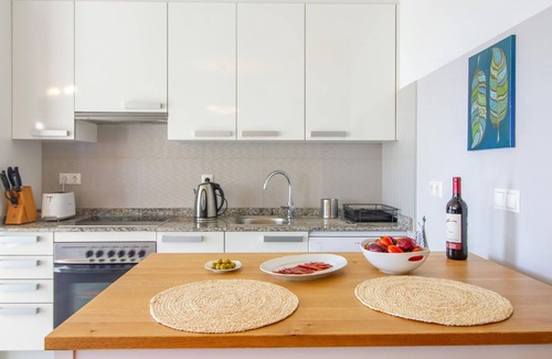 Muchamiel Apartment | Daylight friendly apartment with sea view and shared outdoor pool.