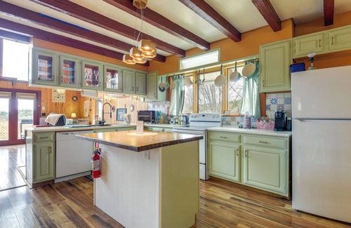 Vernon Apartment | Deck, Mountain Views: Colorful Retreat in Vernon!