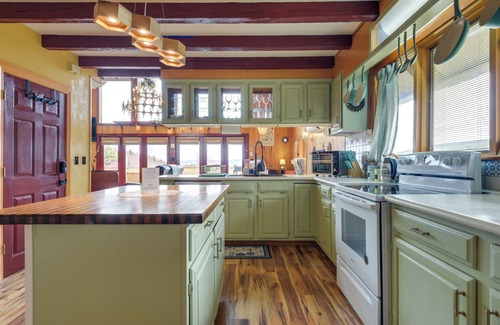 Vernon Apartment | Deck, Mountain Views: Colorful Retreat in Vernon!