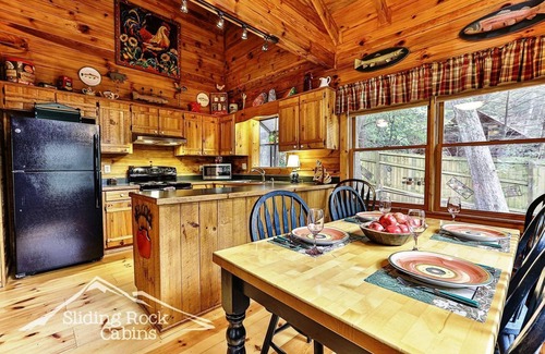 Ellijay Cabin | Deck over Ellijay River, hot tub, fenced yard-pet friendly ADULT ONLY