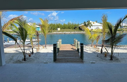 Treasure Cay House | Deep water Canal front home w/dock across the street from the beach.