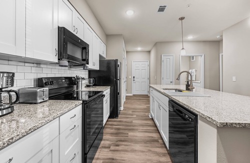 Interchange Square Condo | Deluxe and Spacious Condo w/Pool, Gym and Laundry