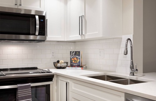 Village North Hotel | Designer Condo close to lifts. Large pool & hot tub, free wifi & secure parking