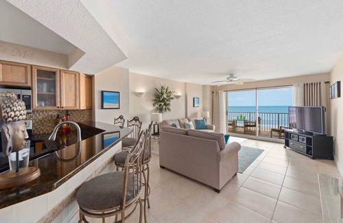 Seawinds Condo Condo | Direct oceanfront condo with a private balcony, heated beachfront pool, and garage