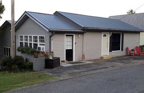 New Concord Cottage | Dock on lake and our 750 sq ft cottage home at Kentucky Lake