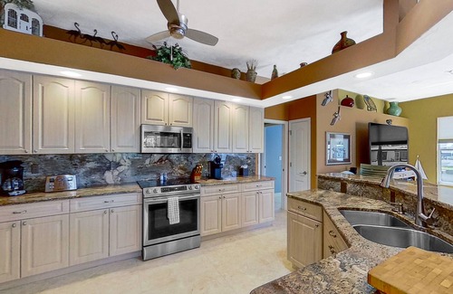 Matlacha Isles House | Dog-friendly waterfront home with heated pool, lanai, central AC, & W/D
