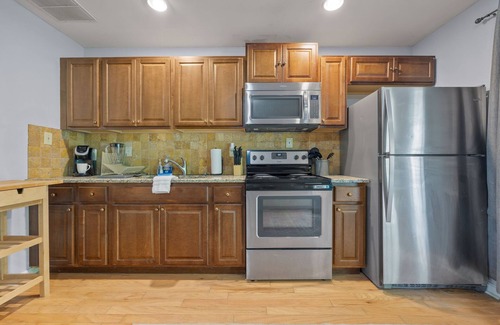 Buford House | Downstairs Unit - Pool + Tennis Access + Patio