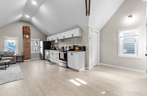 West Central Apartment | Downtown Apt with Wooden Beams & Brick Accents