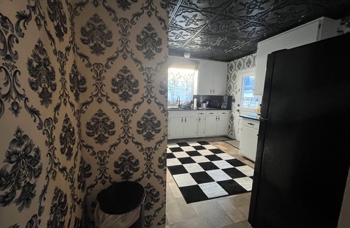 Andalusia House | Elegant 4BR 2BA Andalusia retreat with bunk beds, king suite & modern comforts.