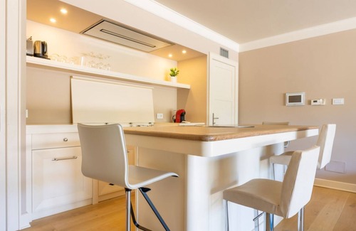 Perugia Apartment | Elegant apartment for two people, arranged on two levels and equipped with all comforts including a balcony and shower with chromotherapy. The apartment is located in a modern condominium complex with a shared swimming pool, which enjoys a pleasant view.