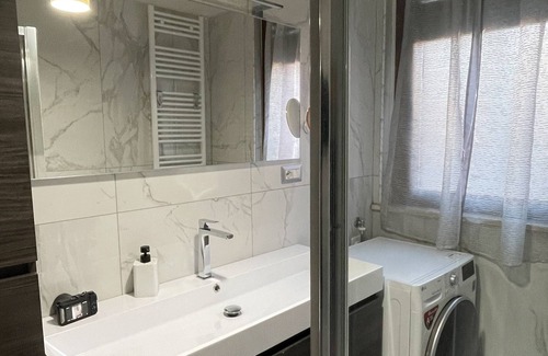 Santa Rita Apartment | Elegant apartment with private parking, a 5-minute walk from INALPI ARENA