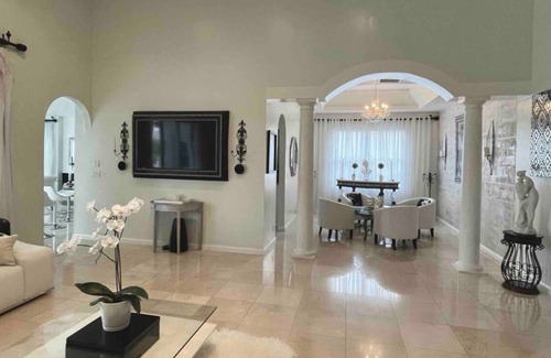 Coral Springs House | Elegant home private pool private patio bar with TV on lake
