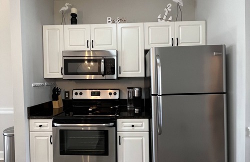 Central Myrtle Beach Condo | Endless Summer Updated Condo at Magnolia Place - Pool & Golf Course Views!