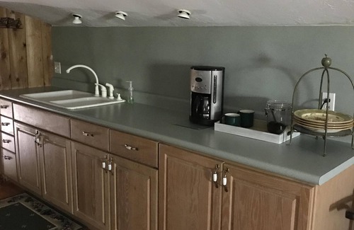 Edmond Cabin | Enjoy our loft with a private hot tub overlooking the vineyard and pond.