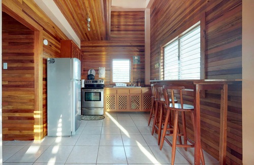 Caye Caulker Cottage | Entire duplex with patio, balcony, partial AC & WiFi - next to a Caribbean beach