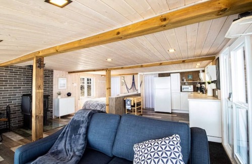 Grondines Cottage | Escape to Riverfront, Relax with Hot Tub, BBQ