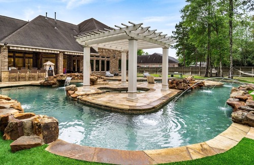 Spring House | Extended-stay paradise: lazy river, theater, poker, Peloton, mini golf and more.