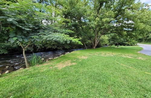 Del Rio RV Rental | Extra large grassy creekside tent site!