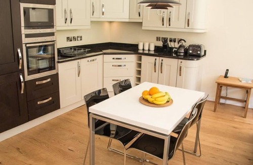 Talland House | Fabulous property with extensive roof terrace, reached by a spiral staircase, affords panoramic view