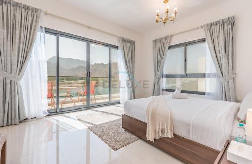 Sharm Apartment | Facing the Sea and Mountains 4BR Villa with Assistant Room and Private Pool, Al Dana Island, Fujairah by Deluxe Holiday Homes
