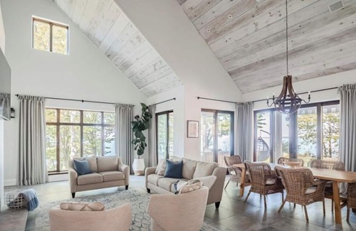 Wainfleet House | Fall Getaway- Luxe Lake House Private beach, lush greenery, family friendly .