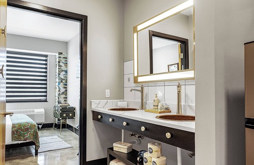 Pacific Hotel | Family suite with private kitchenette in boutique hotel with onsite activities