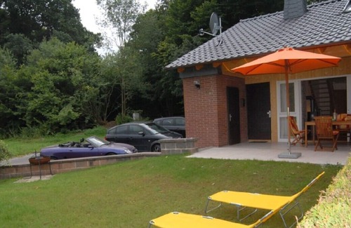 Wrexen House | Fantastic Holiday home with jacuzzi and fireplace at the border of a wood