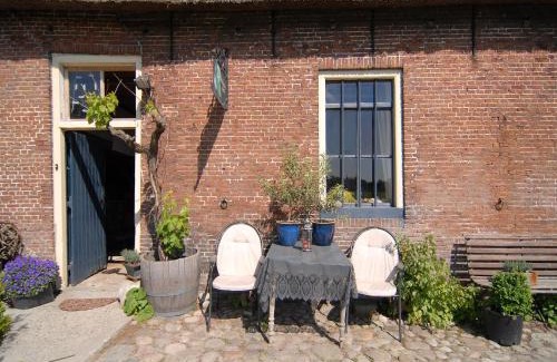 Burum Apartment | Farmhouse by Lauwers River with Rowing Boat, cleaning included