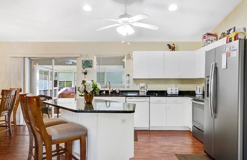 Biggar House | Fenced, private, family friendly villa with exotic poolside views near airport.