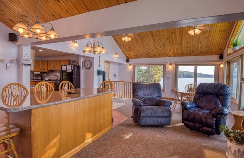 Rangeley House | Fielding Lakehouse - Spacious home with nice grass area leading to Rangeley Lake